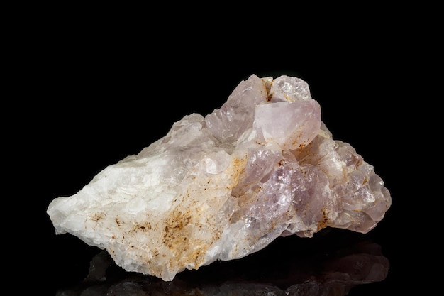 Macro mineral amethyst quartz stone on a black background