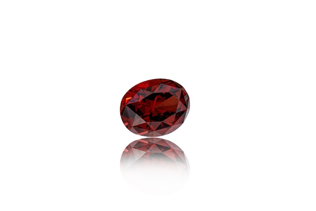 Macro mineral faceted stone Garnet on a white background