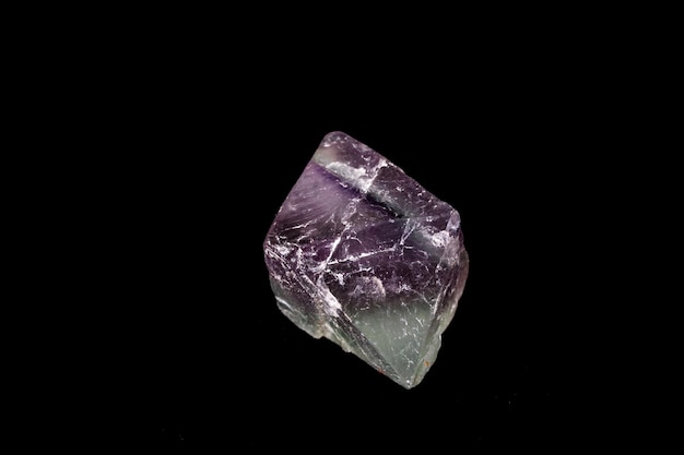 Macro mineral fluorite stone on balck background