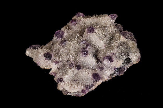 Macro mineral fluorite stone on black background