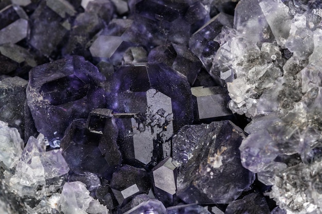 Macro mineral fluorite stone on white background