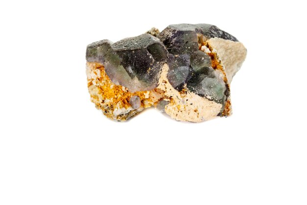 Macro mineral fluorite stone on white background