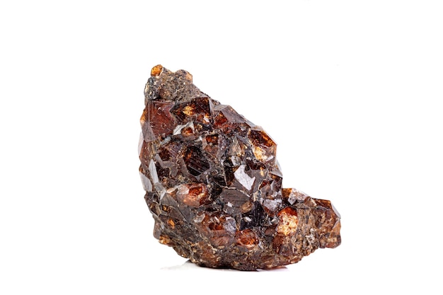 Macro mineral garnet stone on a white background