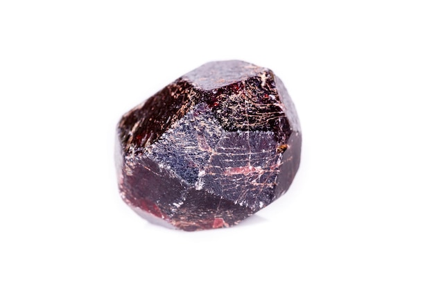 Macro of a mineral garnet stone on a white background