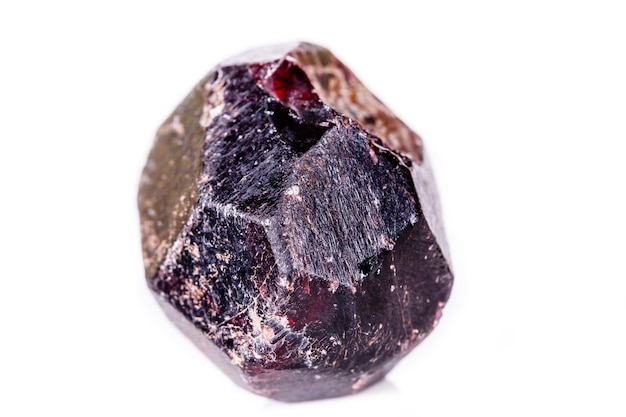 Macro of a mineral garnet stone on a white background