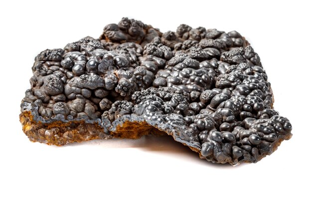 Macro mineral Hematite stone on a white background closeup