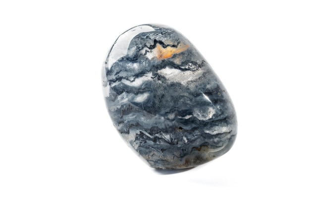 Macro mineral quartz stone with dumortierite on a white background