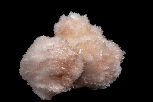 Macro mineral Scolecite stone on a black background