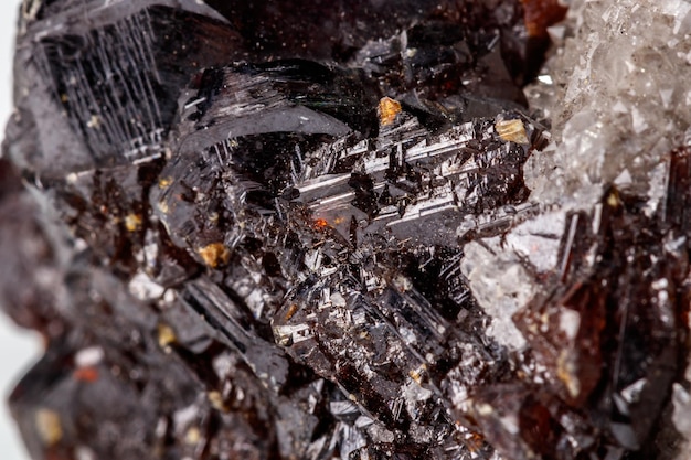 Macro of mineral Sphalerite stone on microcline on white background