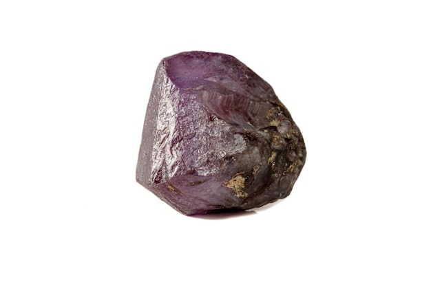 Macro mineral stone alexandrite red violet in daylight on a white