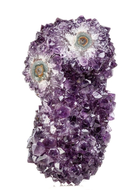 Macro mineral stone Amethyst eye in the form of an owl on a white background