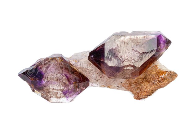 Macro mineral stone Amethyst on smoky quartz on a white background