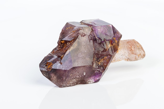 Macro mineral stone Amethyst on smoky quartz on a white background