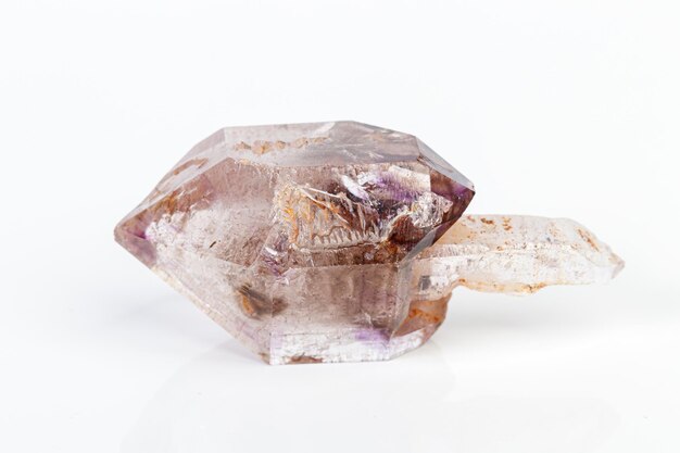 Macro mineral stone Amethyst on smoky quartz on a white background