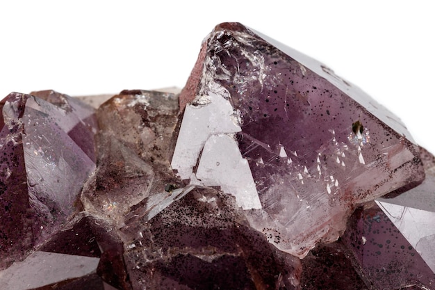 Macro mineral stone Amethysts Goethite Epidote on a white background