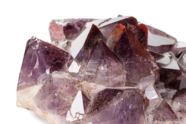 Macro mineral stone Amethysts Goethite Epidote on a white background