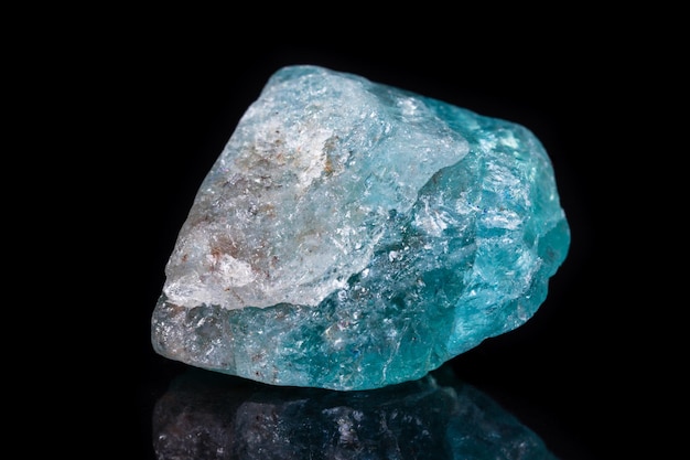 Macro mineral stone apatite on black background