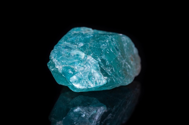 Macro mineral stone apatite on black background