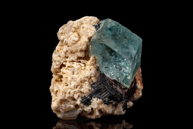 Macro mineral stone aquamarine on a black background