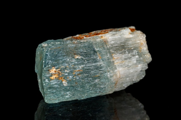 Macro mineral stone aquamarine on a black background