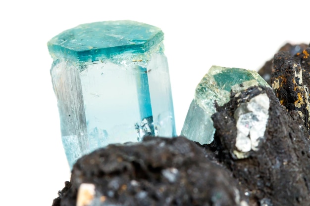 Macro mineral stone Aquamarine and black tourmaline Schorl on a white background