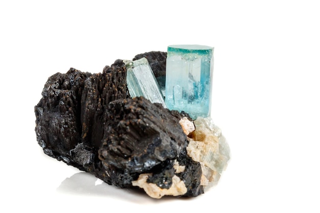 Macro mineral stone Aquamarine and black tourmaline Schorl on a white background