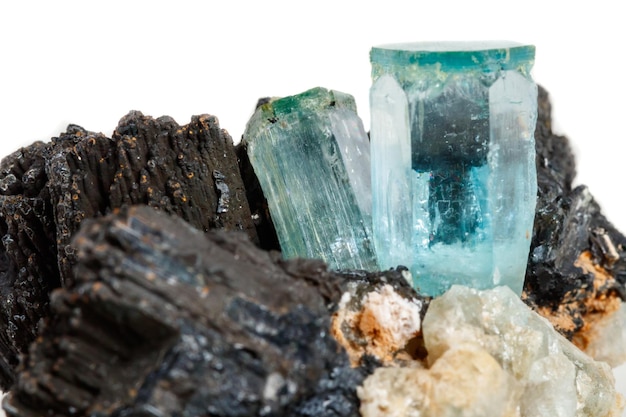 Macro mineral stone Aquamarine and black tourmaline Schorl on a white background