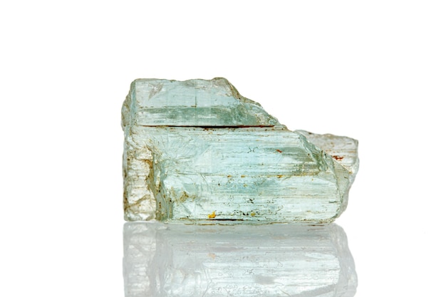 Macro mineral stone aquamarine on a white background