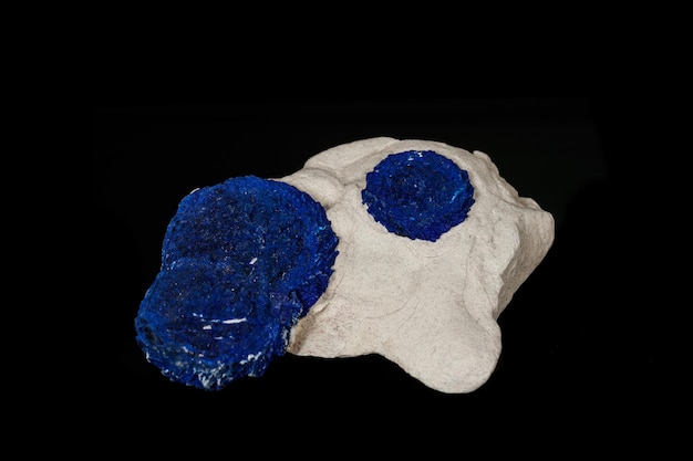 Макроминеральный камень Азурит в алевролите на черном фоне крупным планом