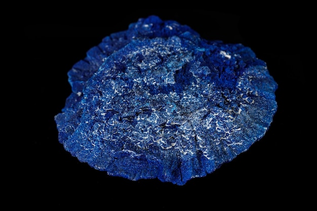 Macro mineral stone Azurite in siltstone against black background