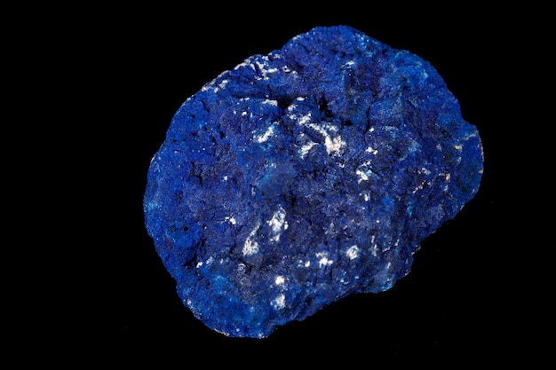 Macro mineral stone Azurite in siltstone against black background