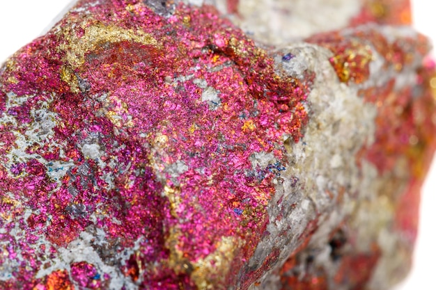 Macro mineral stone Chalcopyrite in the rock on a white background