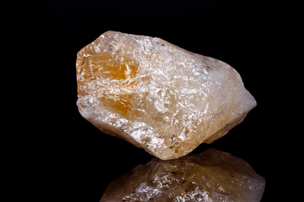 Macro mineral stone Citrine on black background