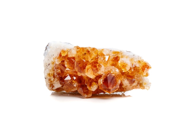 Macro mineral stone Citrine in rock in crystals on a white background