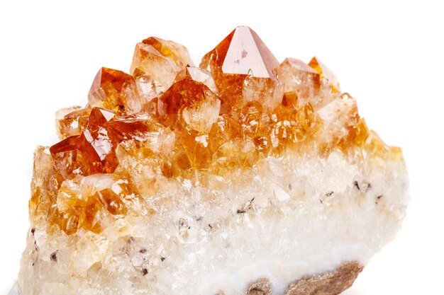 Photo macro mineral stone citrine in rock in crystals on a white background
