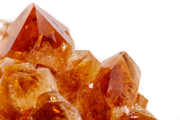 Macro mineral stone Citrine in rock in crystals on a white background