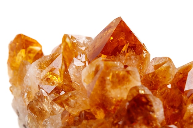 Macro mineral stone Citrine in rock in crystals on a white background