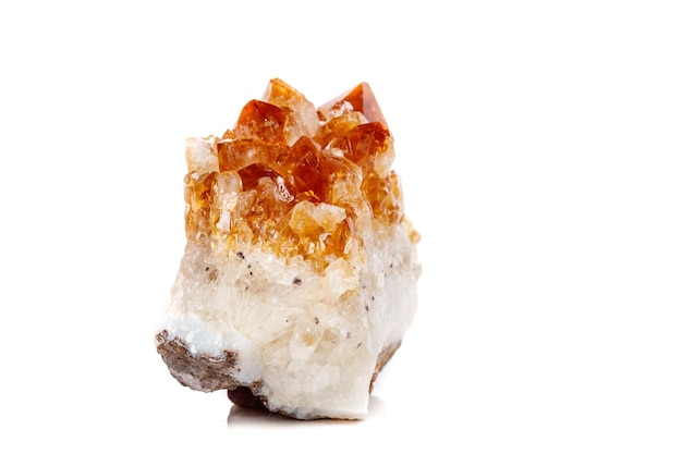 Macro mineral stone Citrine in rock in crystals on a white background