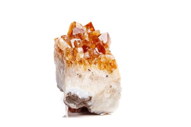 Macro mineral stone Citrine in rock in crystals on a white background