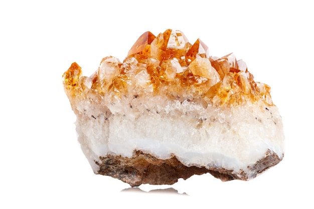 Macro mineral stone Citrine in rock in crystals on a white background