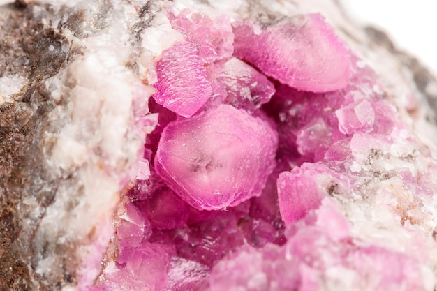 Macro mineral stone Cobalt Calcite rock on white background