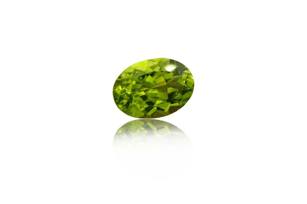 Macro mineral stone cut Peridot on a white background