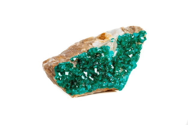 Macro mineral stone Dioptase silicate copper on a white background close-up