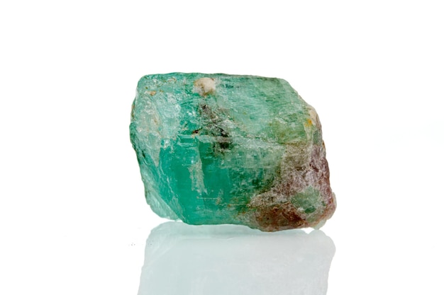 Macro mineral stone emerald on a white background