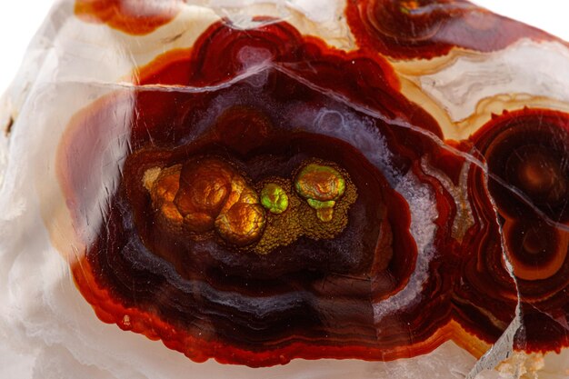 Macro mineral stone fire agate on a white background