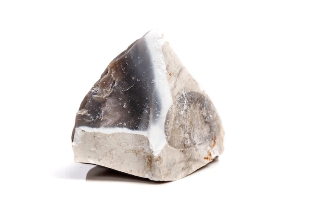 Macro mineral stone Flint in the rock on a white background