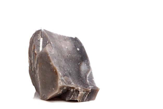 Macro mineral stone Flint in the rock on a white background