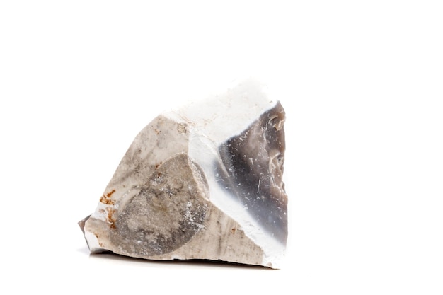 Macro mineral stone Flint in the rock on a white background