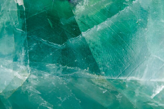 Macro mineral stone Fluorite crystal on a black background