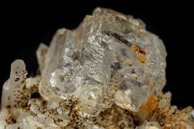 Macro mineral stone fluorite with quartz against black background